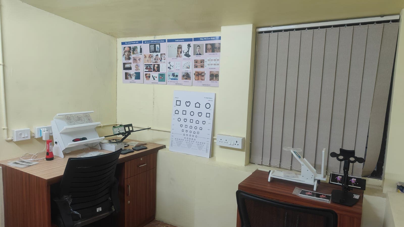Orthoptics room with pediatric vision chart and testing desks